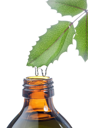 bottle with homeopathy balm and leaf